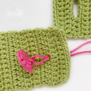 How to Crochet a Button from TurtleBunny Creations - Insert the tails through your project