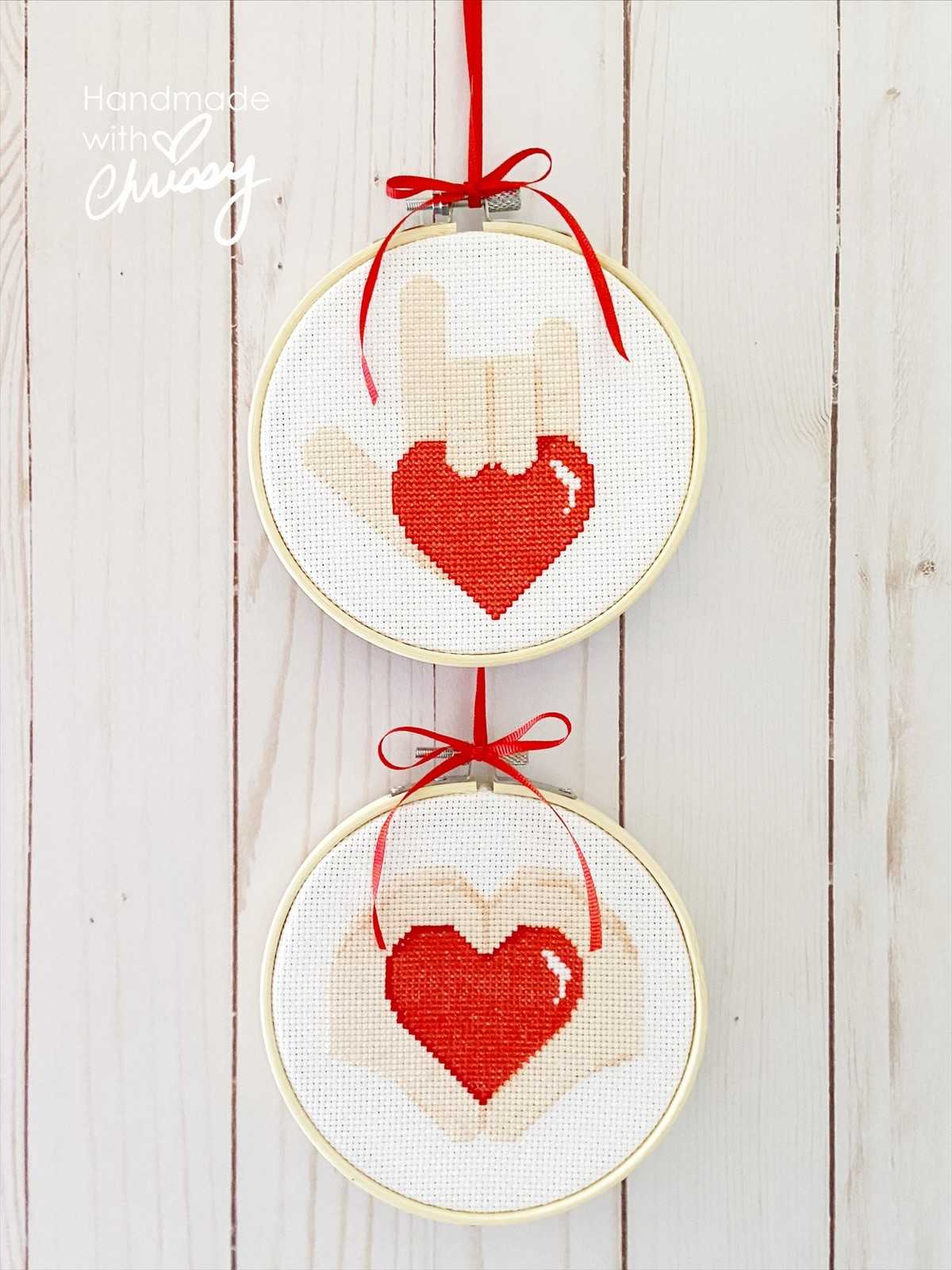 Heart Hands and Sign of Love cross-stitch patterns by Chrissy Habblett, shown finished in standard bamboo embroidery hoops, coordinating patterns for 15% when bought together